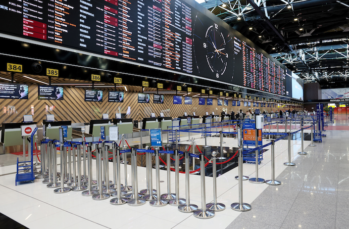 A departures board shows cancelled flights in a half empty check in area at the Sheremetyevo International Airport on Feb. 28.