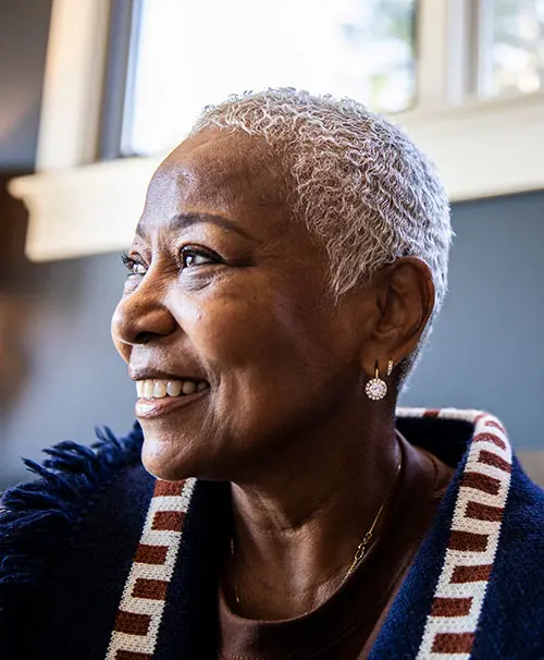 Lady smiling looking into the distance